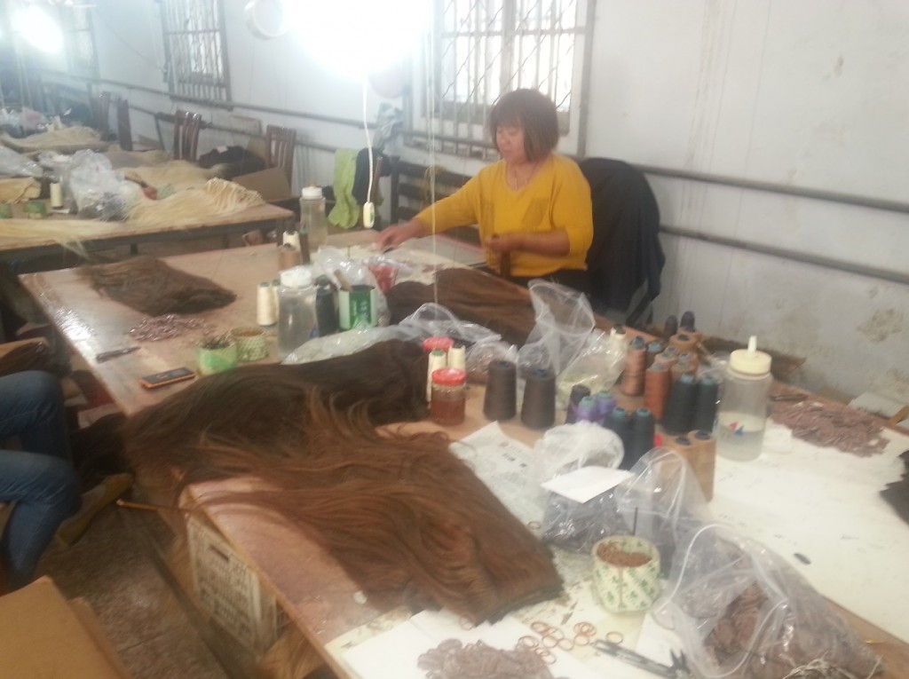 woman working in hair extensions factory
